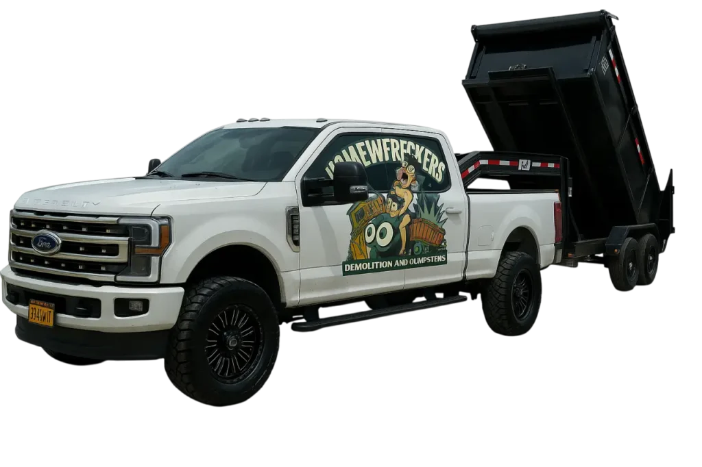 White Ford truck with "Home Wreckers Demolition and Dumpsters" logo and black dumpster tilted for junk removal service.